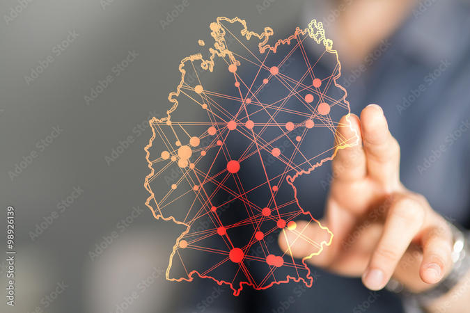 zwei Finger berühren eine digitale Karte von Deutschland